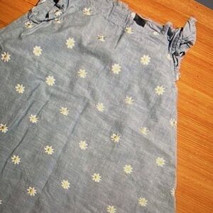 Simple style design features vibrant floral print ruffle dress